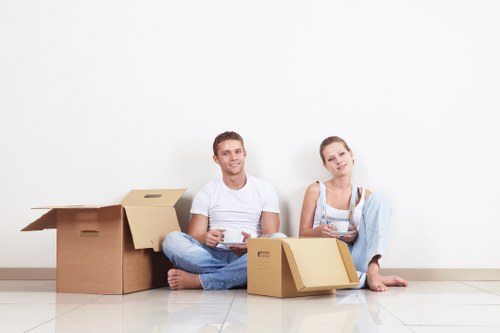 Professional movers packing household items for a local move