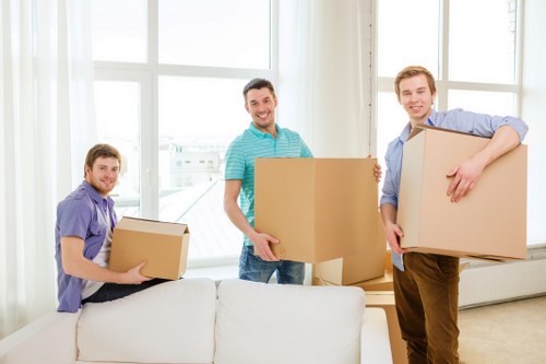Packed boxes and labelled items inside a storage unit