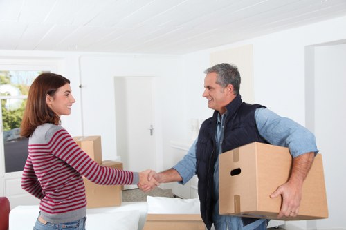 Removal specialists transporting office equipment during a Hackney relocation