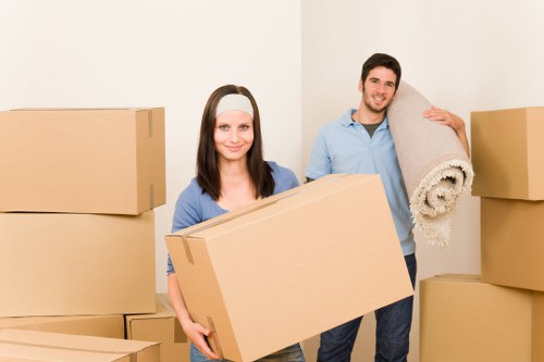 Packed storage unit with labeled boxes and furniture in Hackney