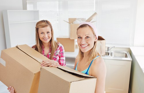 Boxes and furniture prepared for removals in Hackney flat